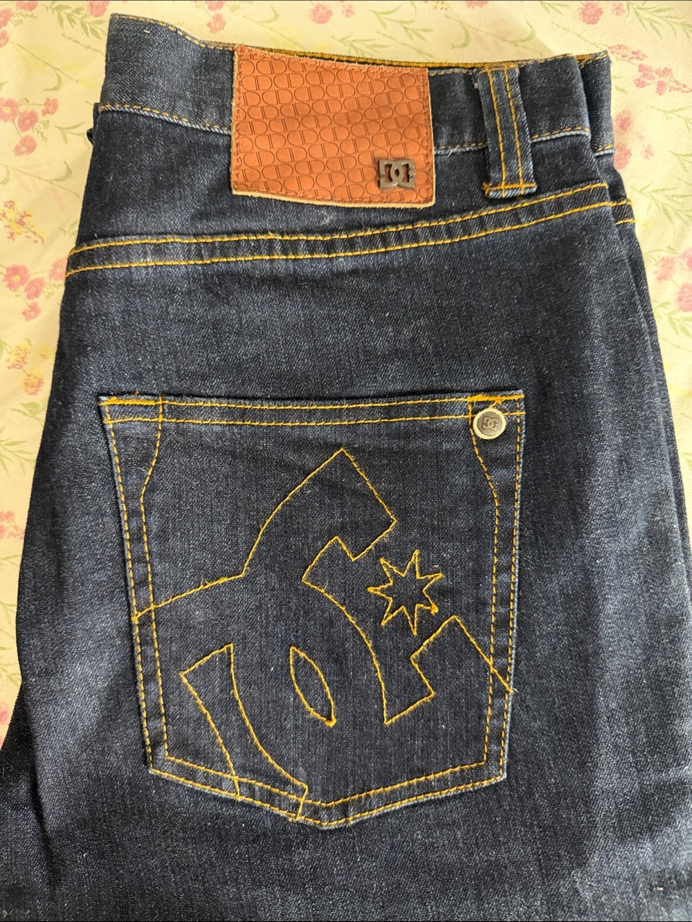 DC Men’s Dark Blue Jeans with Yellow Stitching and Brown Patch